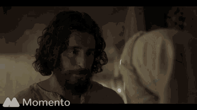 a man with a beard is shown in a momento advertisement