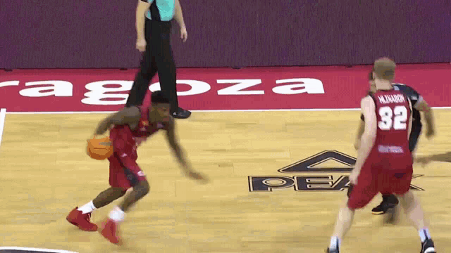 a basketball player wearing a red jersey with the number 32 on it
