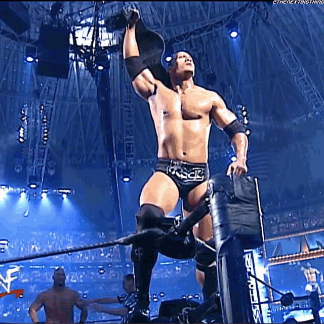 a man in a wrestling ring with the word smack on his trunks