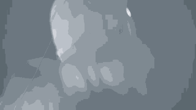 a close up of a person 's face in the dark with smoke coming out of it