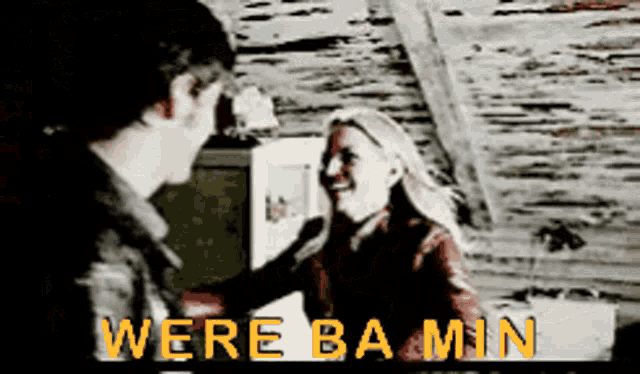 a man and a woman are standing next to each other with the words were ba min written in yellow