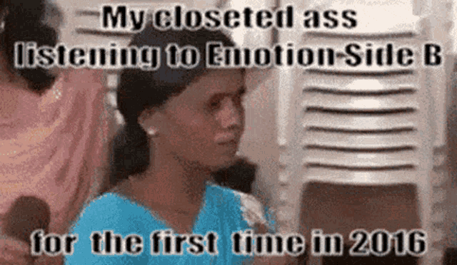 a woman in a blue dress is listening to emotion side b for the first time in 2016 .