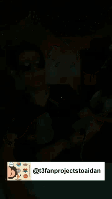 a man wearing sunglasses and a black shirt has a drum icon on his screen