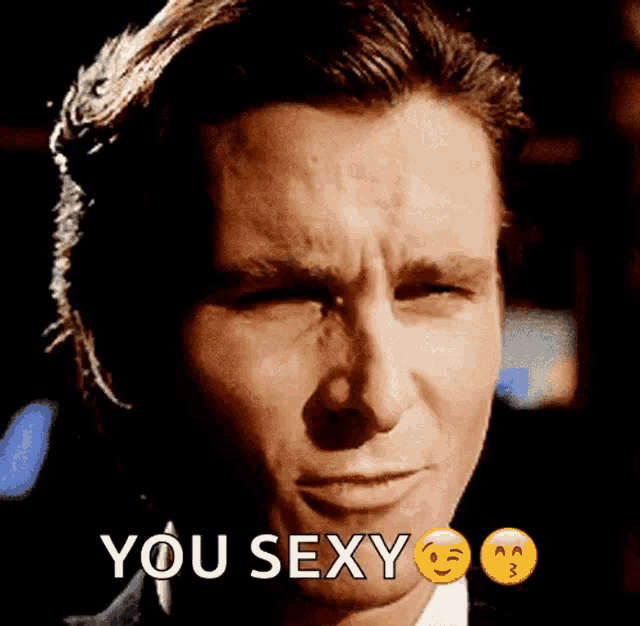 a close up of a man 's face with the words " you sexy " next to him
