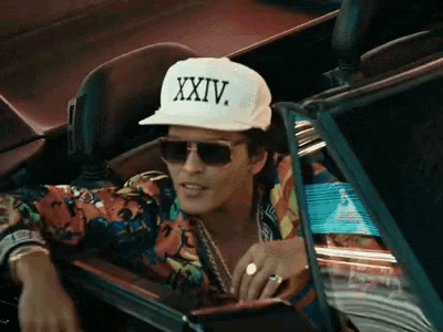 a man wearing sunglasses and a hat that says xxiv