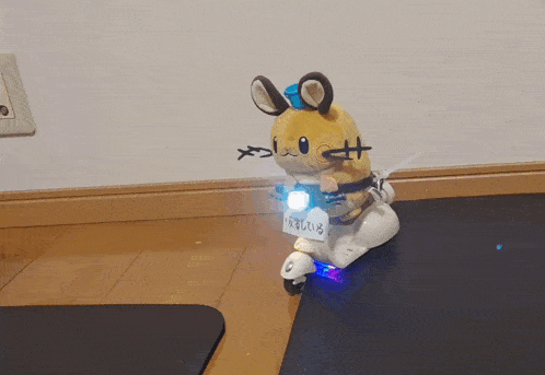 a stuffed animal is riding a scooter with a license plate that says ' a '
