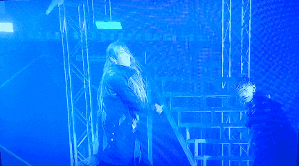 a blue light is shining on a person 's head