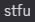 a blurry picture of the word stfu on a dark background
