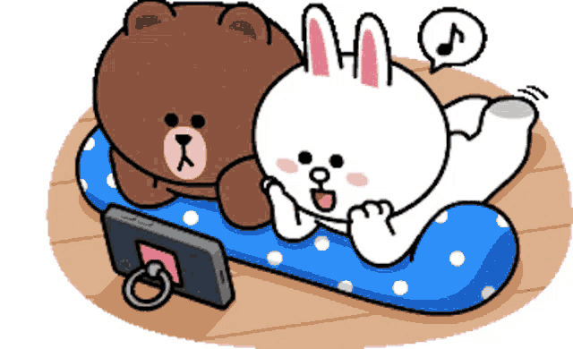 a brown bear and a white rabbit laying on a blue polka dot pillow