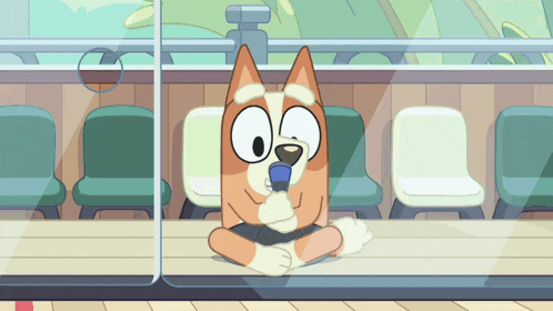 a cartoon dog is sitting at a table in front of a window