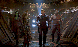 a group of guardians of the galaxy are standing next to each other