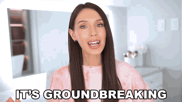 a woman says it 's groundbreaking in a pink shirt
