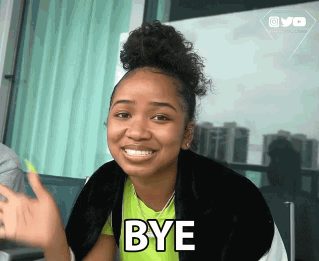 a girl with braces on her teeth is smiling and saying bye