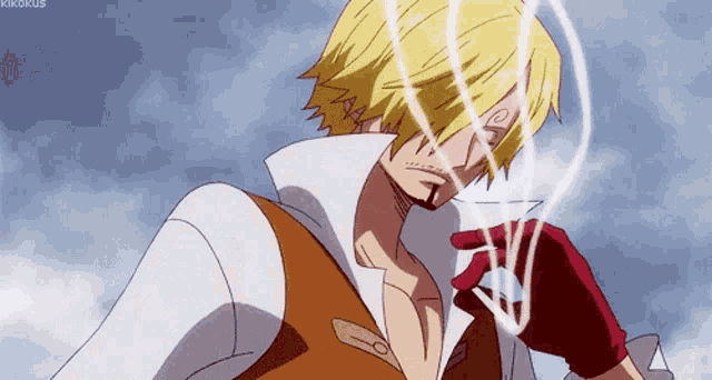 a man with blonde hair and red gloves looks at something