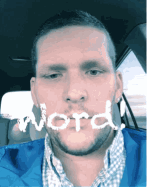 a man in a blue jacket has the word word written on his face