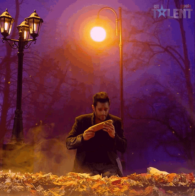 a man standing in front of a street light with the word talent on the bottom right