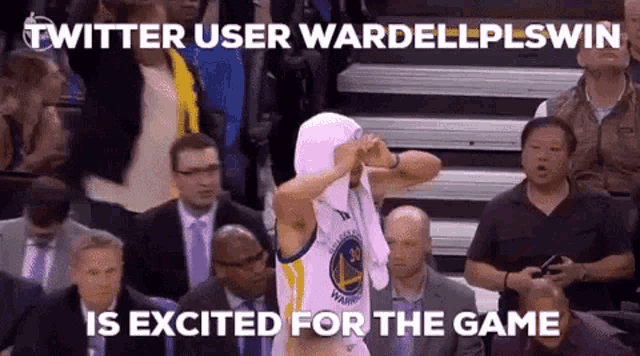 a basketball player with a towel around his head is excited for the game