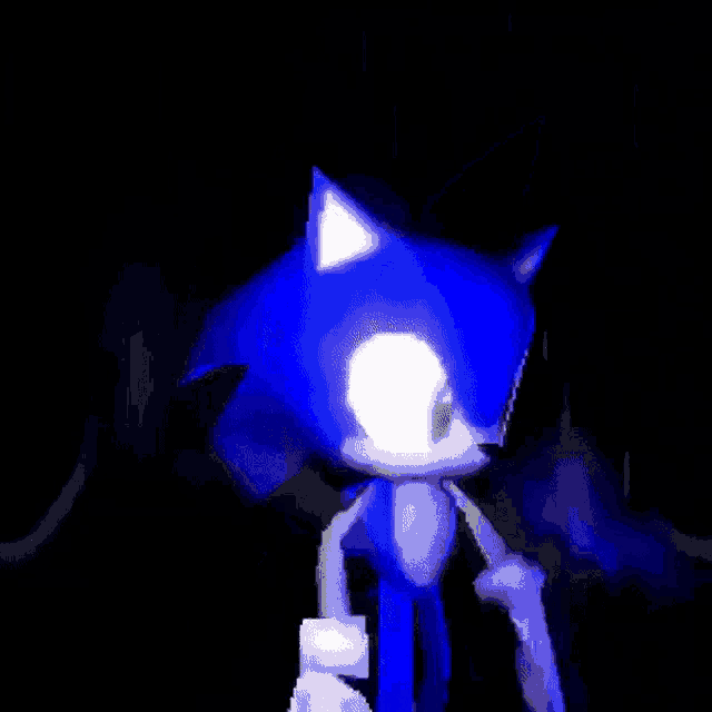 sonic the hedgehog is standing in the dark with a blue light behind him