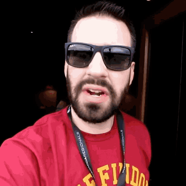 a man wearing sunglasses and a lanyard that says florida