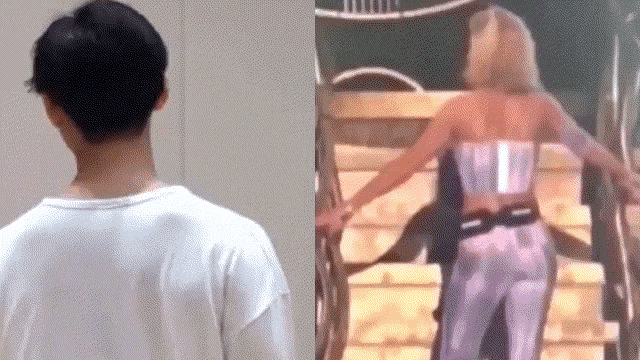 a man in a white shirt is standing next to a woman in a white corset