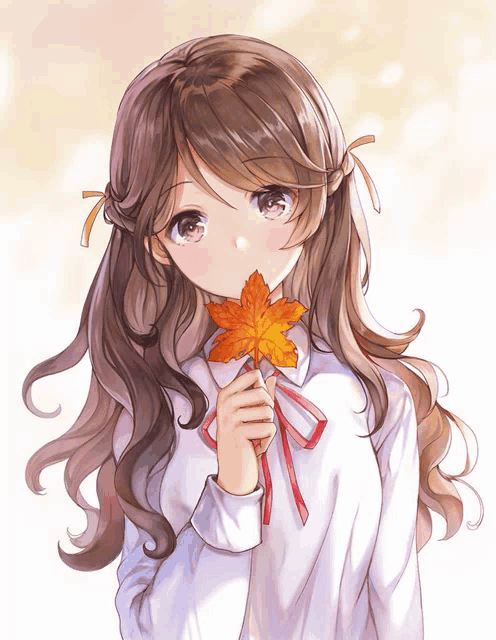 a girl with long hair is holding a maple leaf in her hand