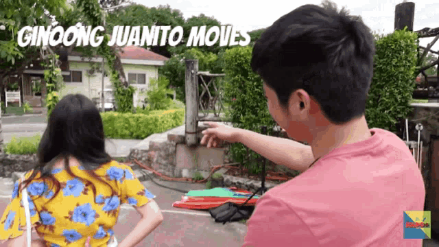 a man in a pink shirt is pointing at something with the words ginoong juanito moves written above him