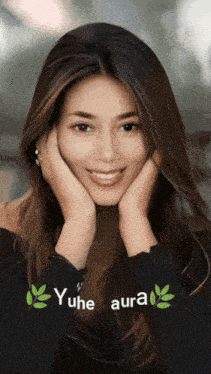 a woman with her hands on her face has yuhe aura written on the bottom right