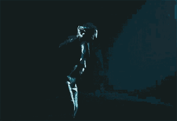 a person is jumping in the water with their feet in the air