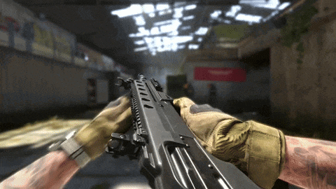 a person is holding a gun in a room with a sign that says ' t.v. ' on it