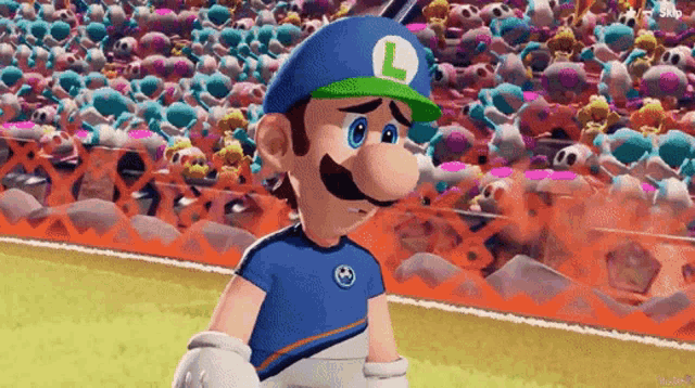 a cartoon character wearing a blue shirt and a green hat with the letter l on it is standing on a field .