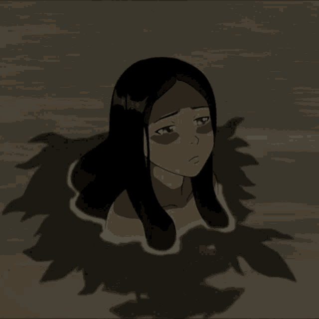 a girl with long black hair is laying in the water