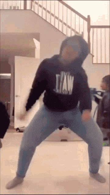 a man wearing a hoodie that says jaw is dancing