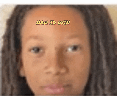 a close up of a person 's face with the words nah id win written above it
