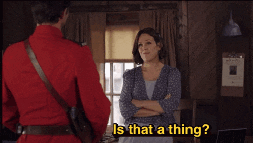 a man in a red uniform stands next to a woman with the words is that a thing on the bottom