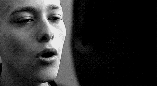 a close up of a person 's face with their mouth open .