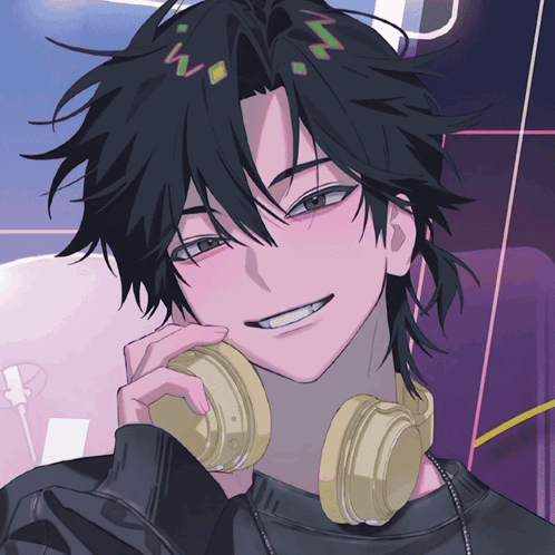a boy with headphones around his neck is smiling