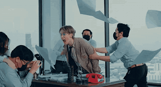 a man wearing a mask is being attacked by another man