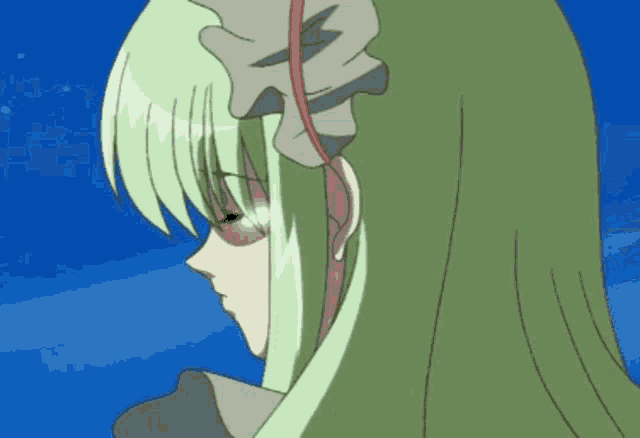 a girl with long green hair and a red flower in her hair