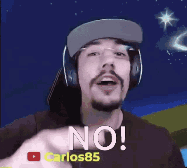 a man with a beard wearing headphones and a hat says no