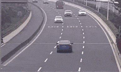 a row of cars are driving down a highway with the letter c on the side