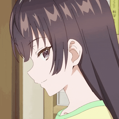 a close up of a girl 's face with a few letters on her hair