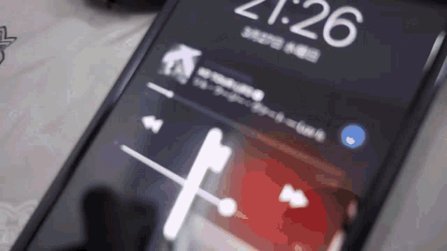 a close up of a cell phone displaying the time of 21:26