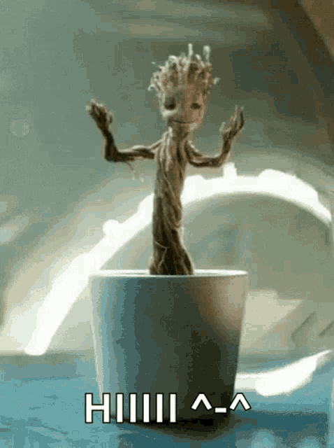 a gif of groot from guardians of the galaxy dancing in a white pot
