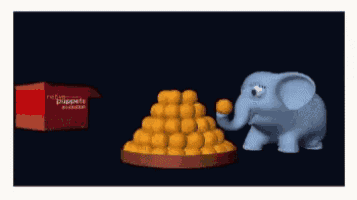 a blue elephant is standing next to a pile of potato balls