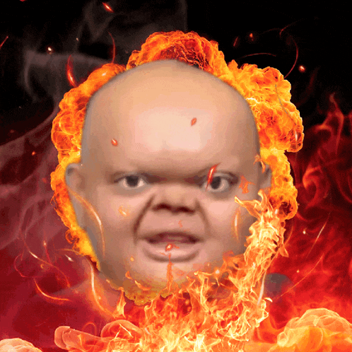 a man 's head is surrounded by flames and fire