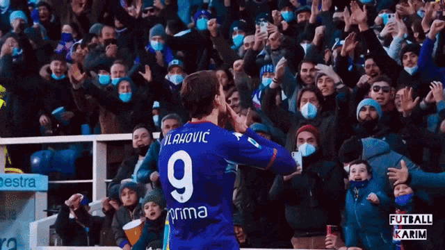 a soccer player wearing a jersey with the number 9 on the back