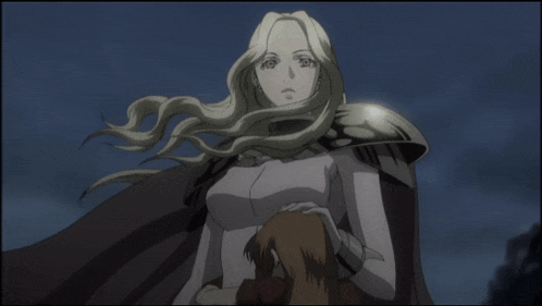 a woman with long blonde hair is holding a child