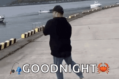 a man is walking on a dock with the words goodnight written on the bottom