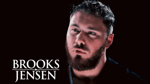 a man with a beard and the name brooks jensen written above him