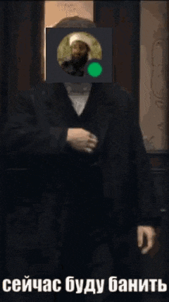 a man in a suit has a picture of a man in a green circle on his face ..
